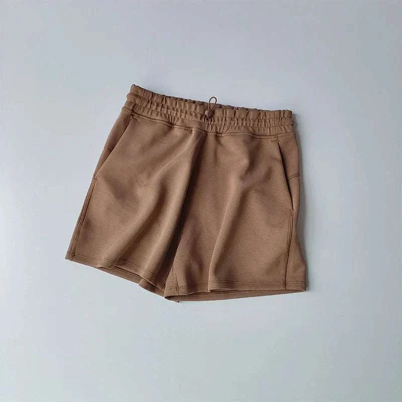 Women wearing high waisted quick drying running shorts for fitness and yoga