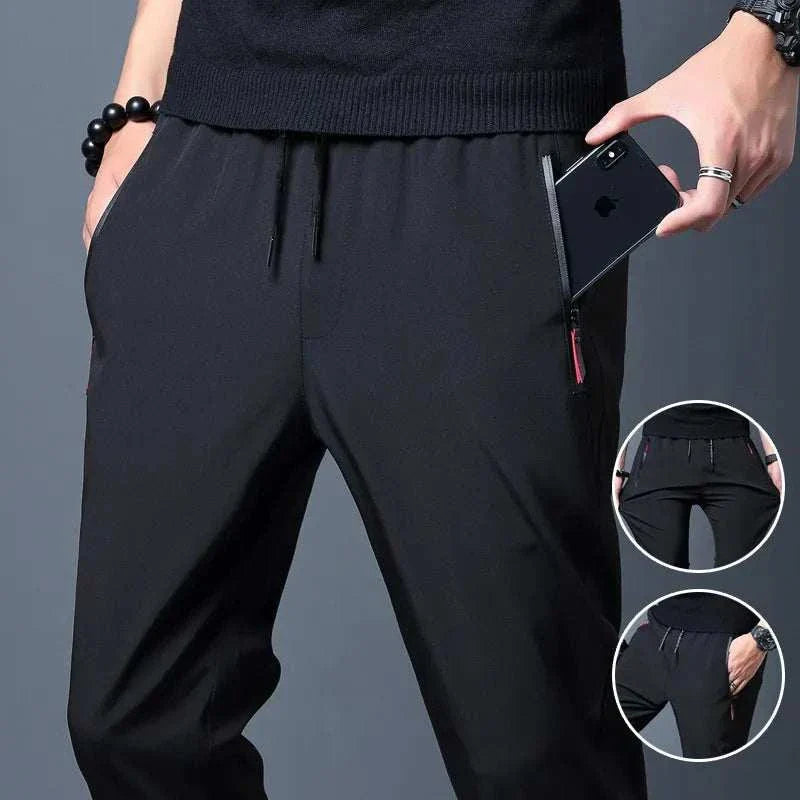 Men running pants made of quick-dry polyester with drawstring closure and zipper pockets for sports and casual wear