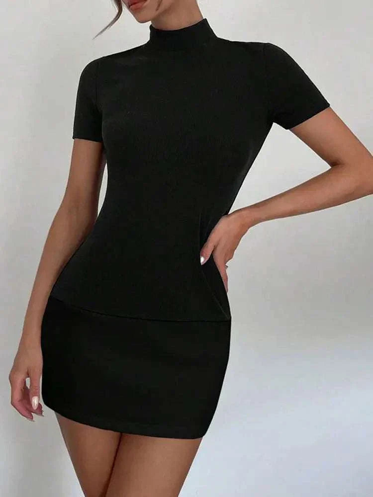 Woman wearing a slim fit patchwork summer female mini dress with O-neck and short sleeves