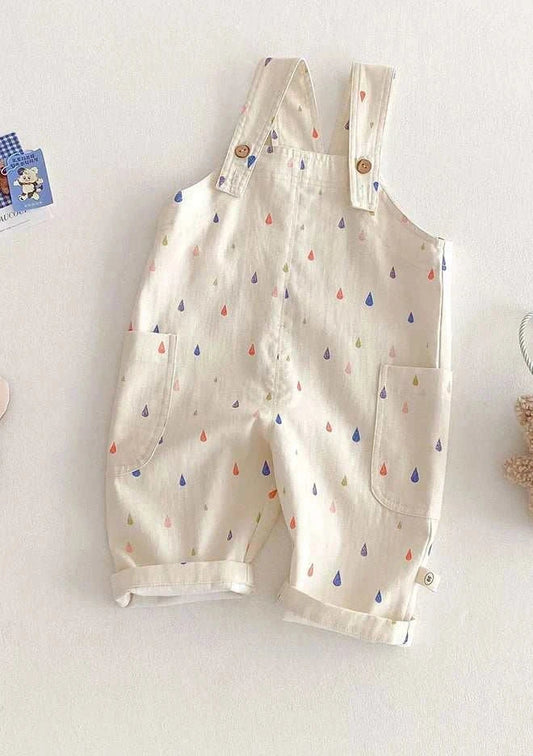 Unisex spring kids cotton and polyester overalls with multicolor polka dot pattern and button fly closure